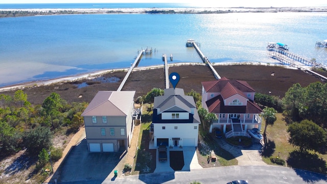 bird's eye view featuring a water view and a view of the beach