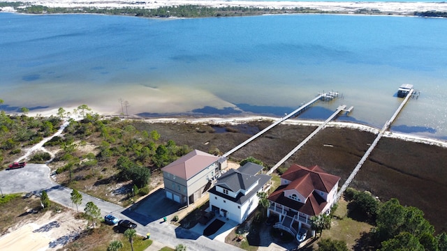 birds eye view of property featuring a view of the beach and a water view