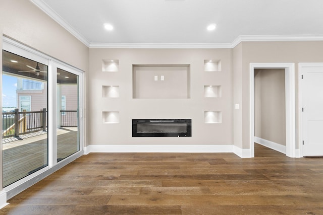 unfurnished living room featuring crown molding, dark hardwood / wood-style floors, and heating unit