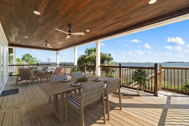wooden deck featuring ceiling fan, outdoor dining space, and an outdoor hangout area