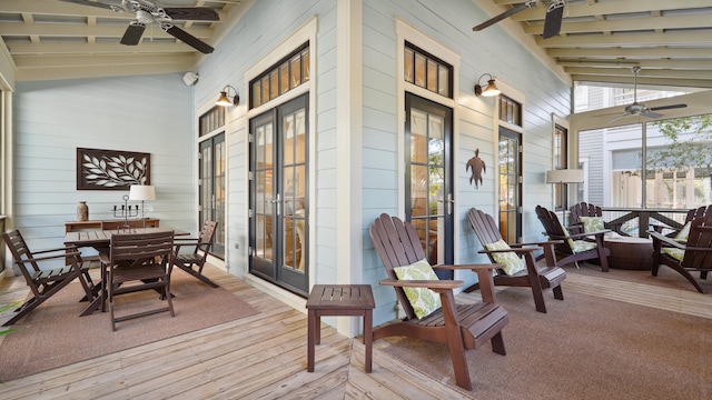 sunroom / solarium with vaulted ceiling with beams and ceiling fan