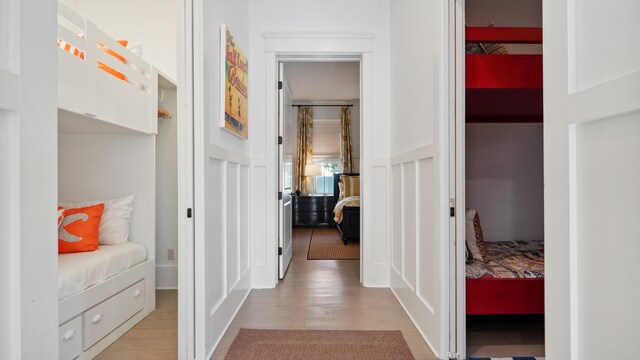 corridor with light hardwood / wood-style flooring