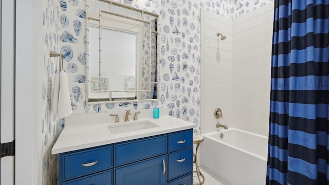 bathroom featuring shower / tub combo with curtain and vanity