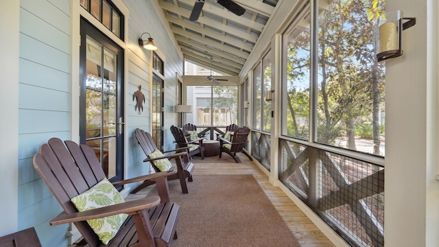 sunroom featuring ceiling fan and vaulted ceiling