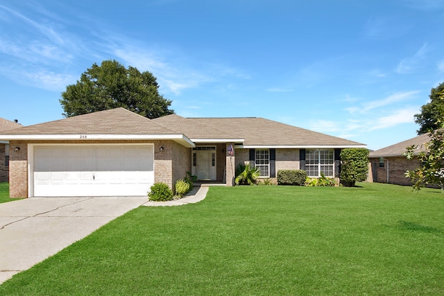 ranch-style home with a garage and a front lawn