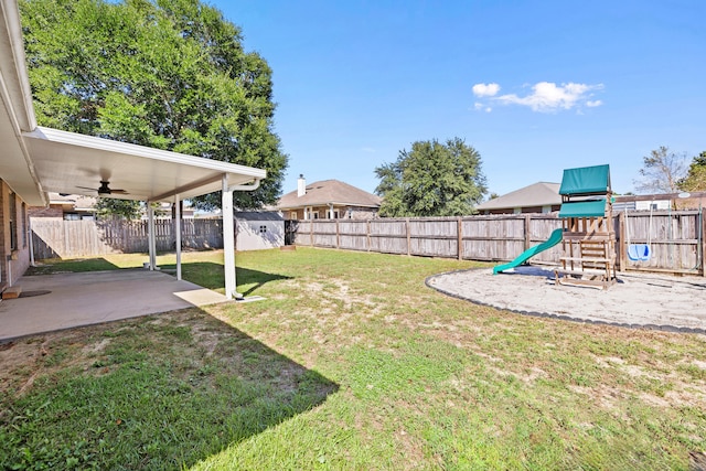 view of yard featuring a playground and a patio area