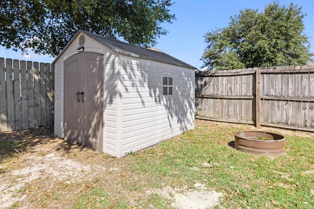 view of outbuilding with a lawn