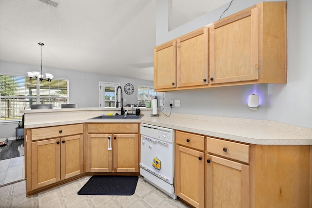 kitchen featuring dishwasher, plenty of natural light, a notable chandelier, and sink