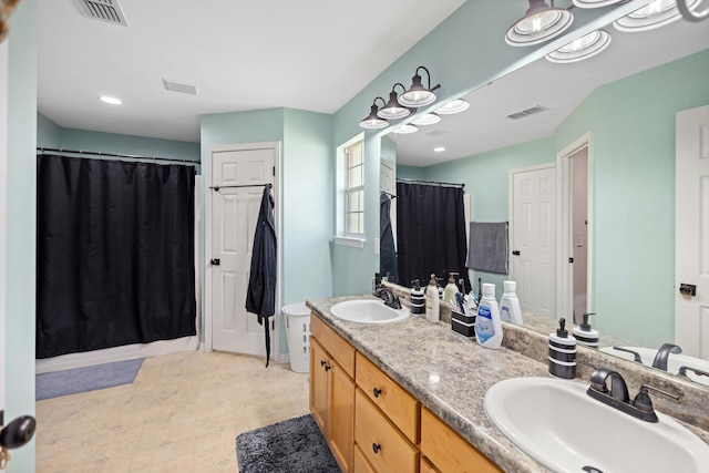 bathroom with a shower with curtain and vanity