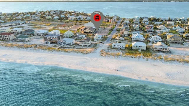 bird's eye view featuring a water view and a beach view