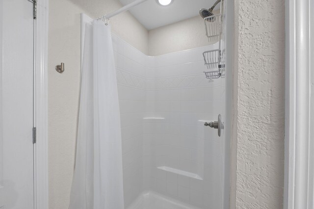 bathroom with a shower with curtain