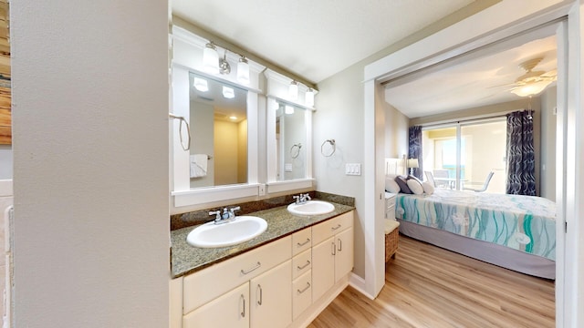 bathroom featuring vanity, ceiling fan, and hardwood / wood-style flooring