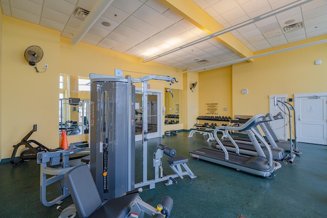 workout area featuring a paneled ceiling