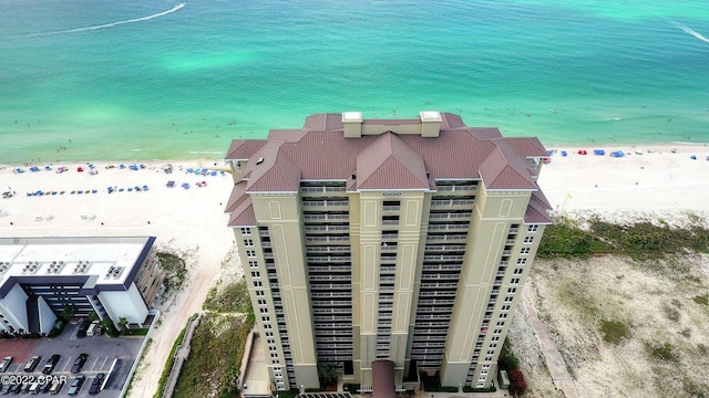 bird's eye view with a beach view and a water view