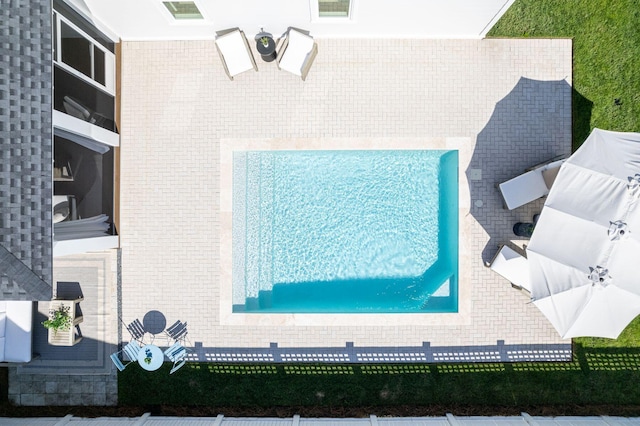 view of swimming pool featuring a patio area