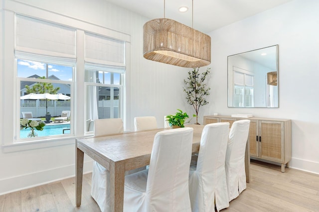 dining space with light hardwood / wood-style flooring