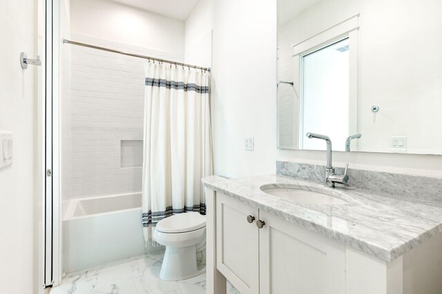 full bathroom featuring vanity, shower / tub combo, and toilet