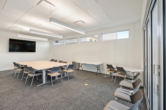 interior space with baseboards and carpet flooring