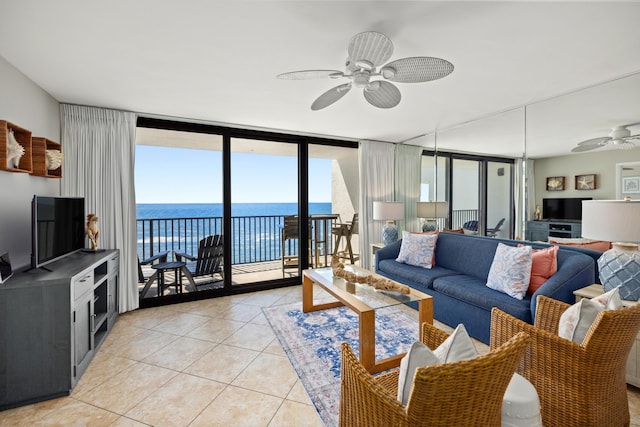 living room with light tile patterned floors, ceiling fan, and floor to ceiling windows
