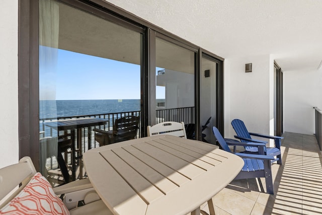 balcony featuring a water view