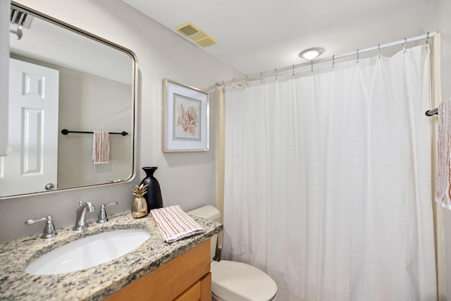 full bath with visible vents, toilet, a shower with shower curtain, and vanity