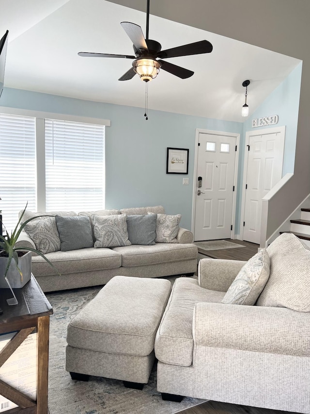 living room with lofted ceiling, ceiling fan, and hardwood / wood-style floors