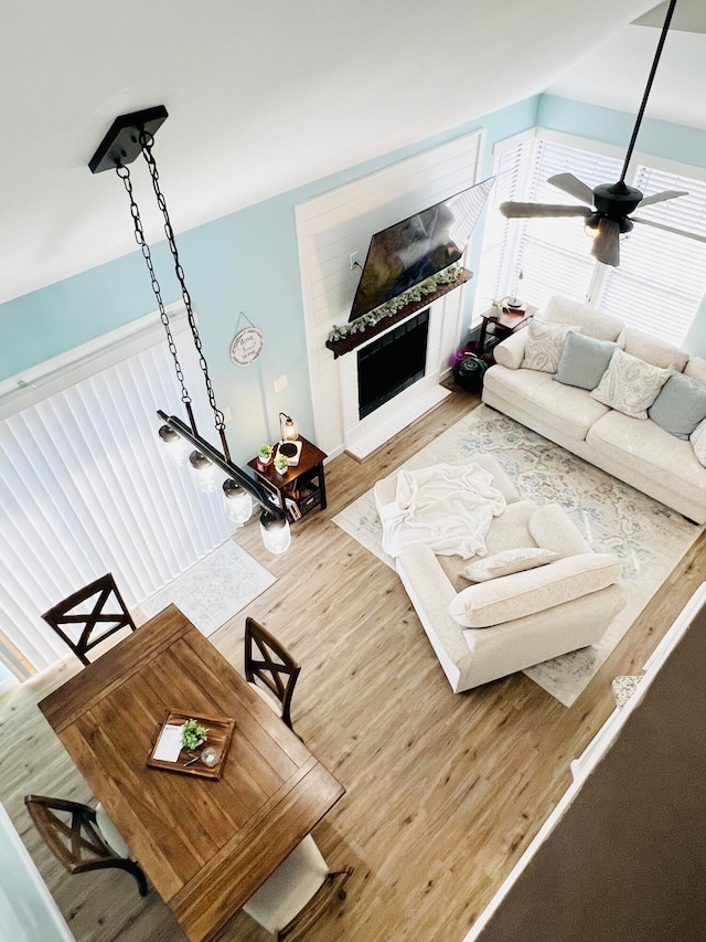 living room featuring ceiling fan and hardwood / wood-style flooring