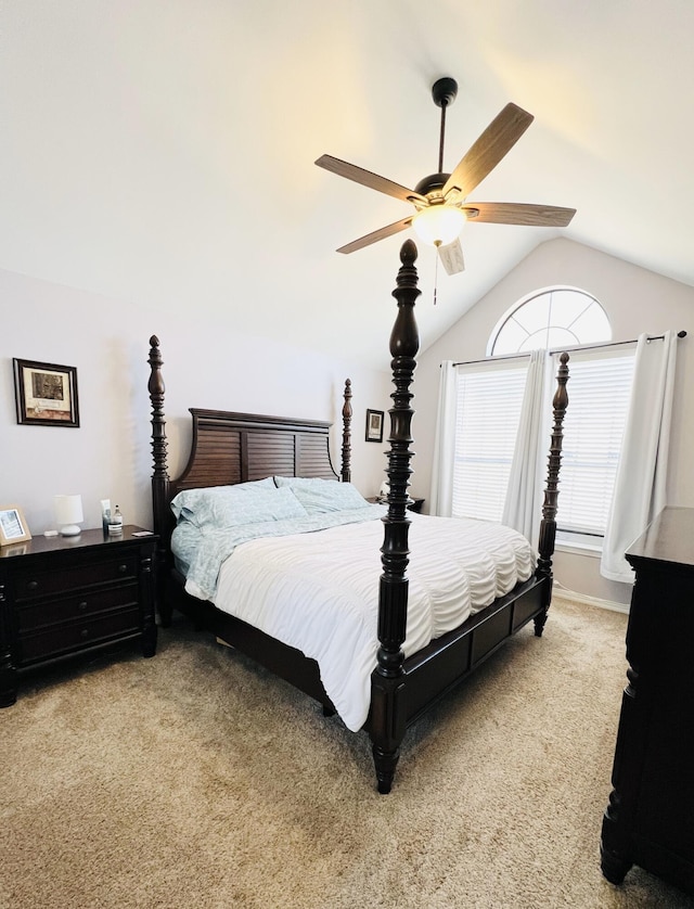 bedroom with ceiling fan, carpet flooring, and vaulted ceiling