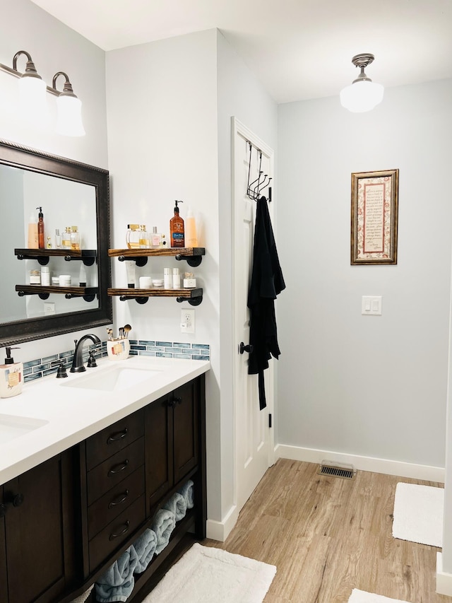 bathroom with vanity and hardwood / wood-style flooring