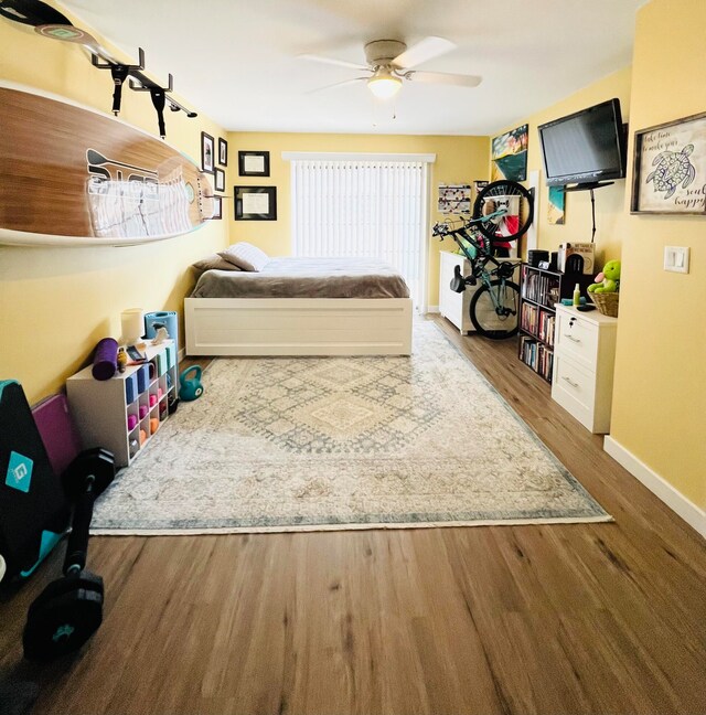 bedroom with hardwood / wood-style floors