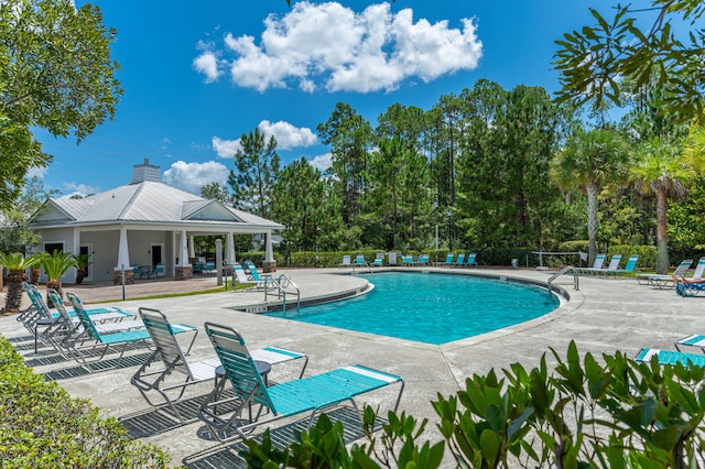 view of swimming pool with a patio