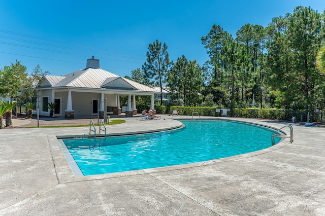 view of pool featuring a patio area