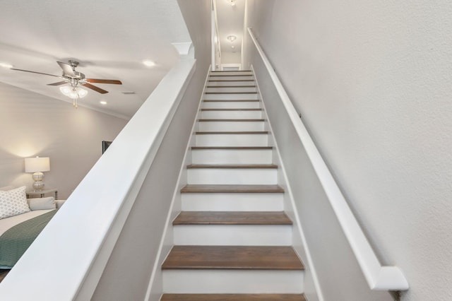 staircase with ceiling fan