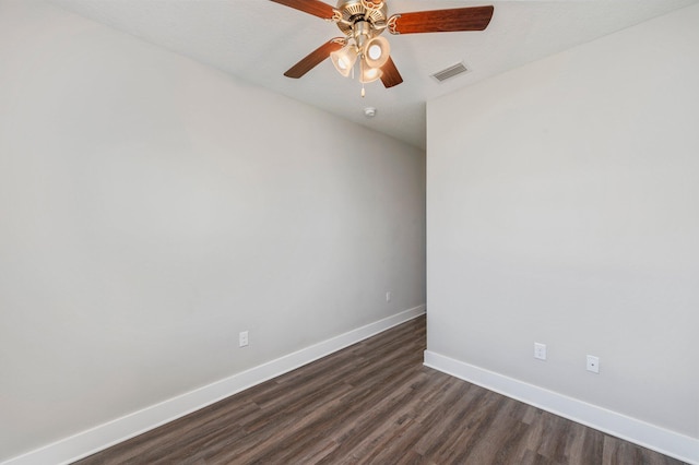 spare room with ceiling fan and dark hardwood / wood-style floors