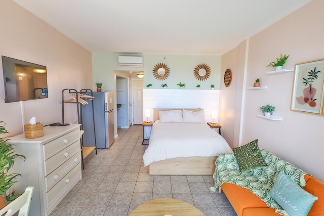 bedroom featuring stainless steel fridge and an AC wall unit