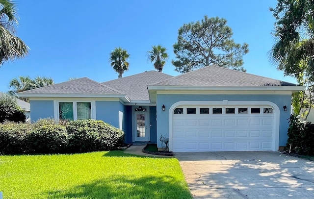 single story home featuring a garage and a front yard