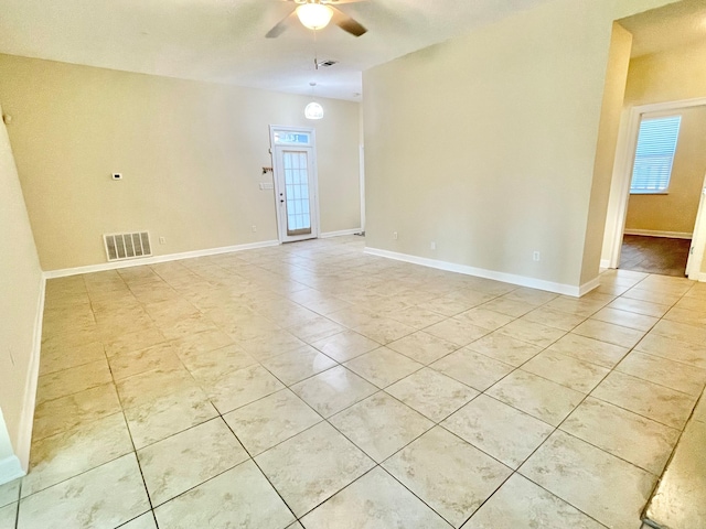 unfurnished room with ceiling fan