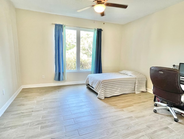 bedroom featuring light hardwood / wood-style floors and ceiling fan