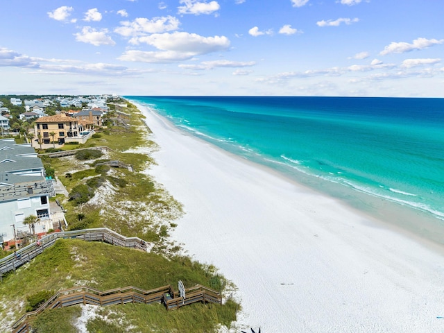 aerial view featuring a water view and a view of the beach