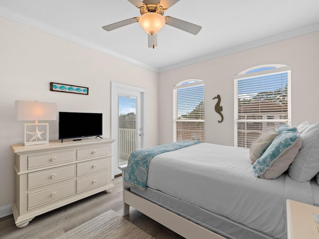 bedroom featuring ornamental molding, light wood-type flooring, ceiling fan, and access to outside