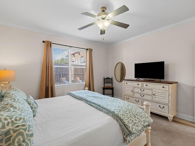 bedroom featuring ceiling fan, carpet floors, and crown molding