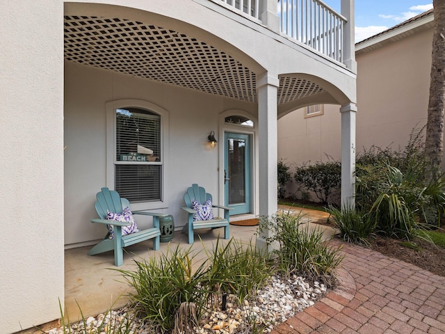 entrance to property with a balcony