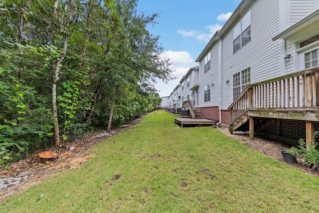 view of yard with a wooden deck