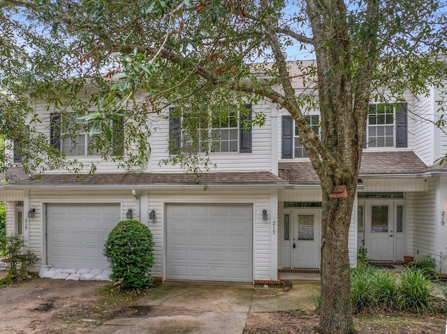 townhome / multi-family property featuring a garage