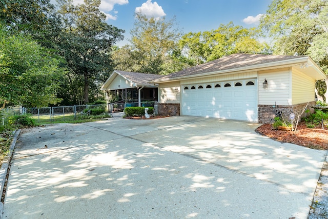 single story home featuring a garage