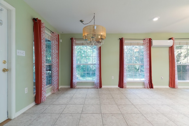 interior space with an inviting chandelier, a wall mounted air conditioner, and light tile patterned flooring