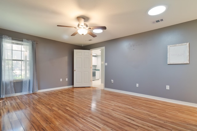 unfurnished room with ceiling fan and light hardwood / wood-style flooring