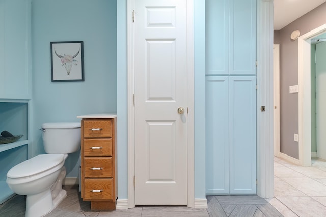 bathroom featuring tile patterned floors and toilet