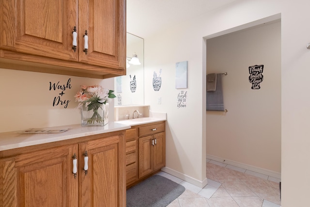 bathroom with tile patterned flooring and vanity