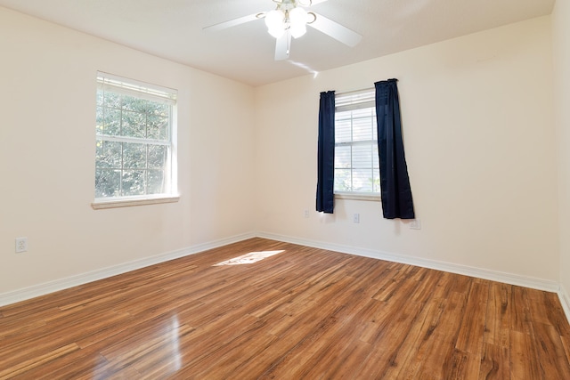 unfurnished room featuring ceiling fan and hardwood / wood-style flooring